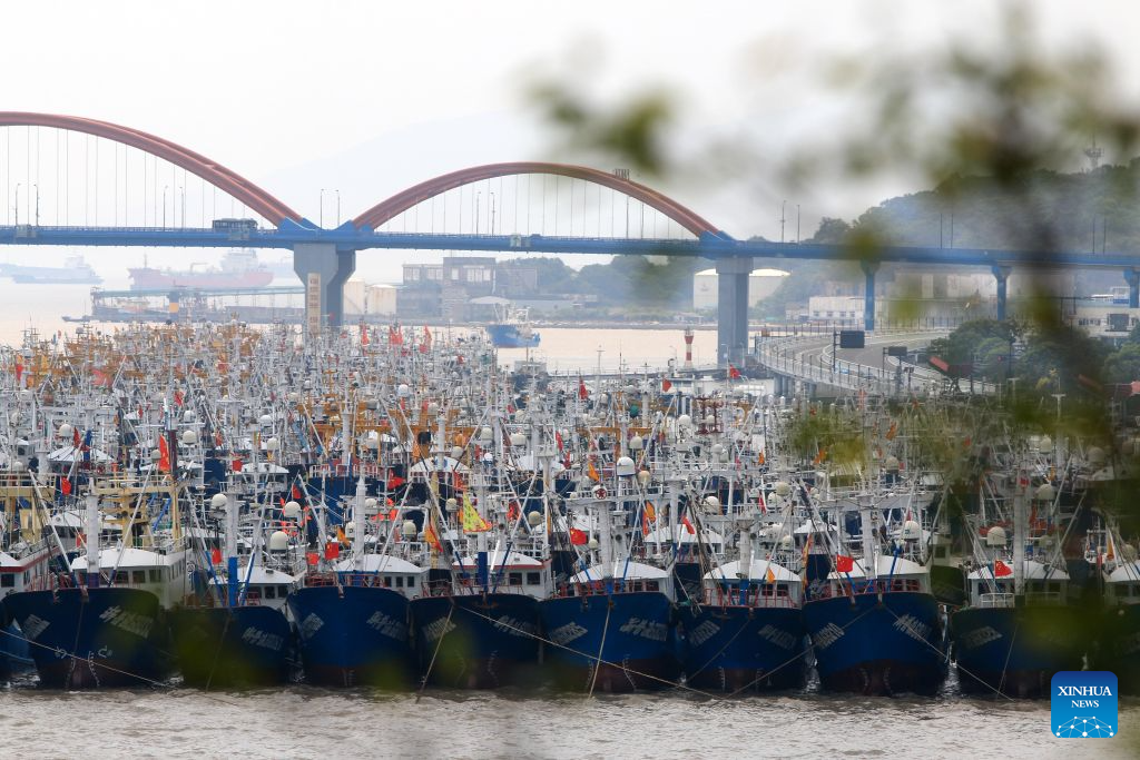 Fishing boats take shelter from the upcoming typhoon at a port in Zhoushan, east China's Zhejiang Province, Aug. 5, 2026.
As Typhoon Dolphin, the 13th typhoon of 2026, is approaching the East China Sea, Zhejiang activated an emergency response along its coastal areas from 6 p.m. Wednesday. (Photo by Hu Sheyou/Xinhua)
