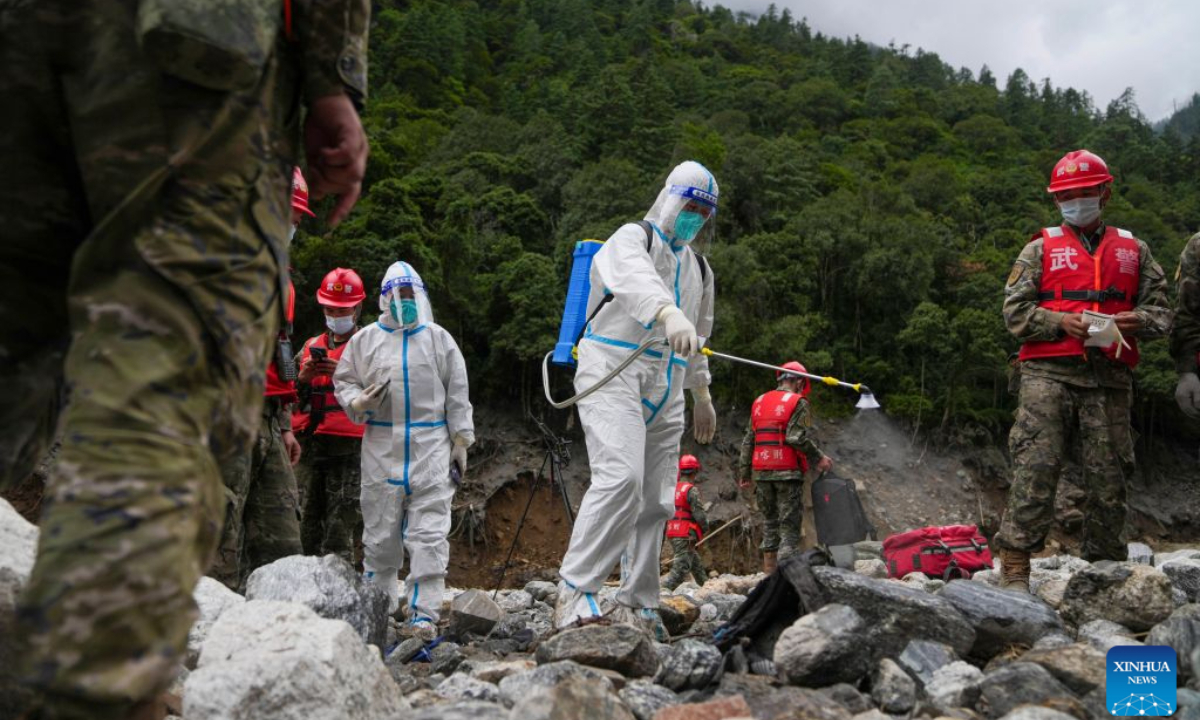 Workers conduct disinfection operations at the mudslide-hit area in Gyirong County, southwest China's Xizang Autonomous Region, Aug. 30, 2026. Disinfection operations were carried out after a devastating mudslide, triggered by an ice-rock avalanche in Nepal, hit the border port of Gyirong in southwest China's Xizang Autonomous Region. (Xinhua/Jigme Dorje)