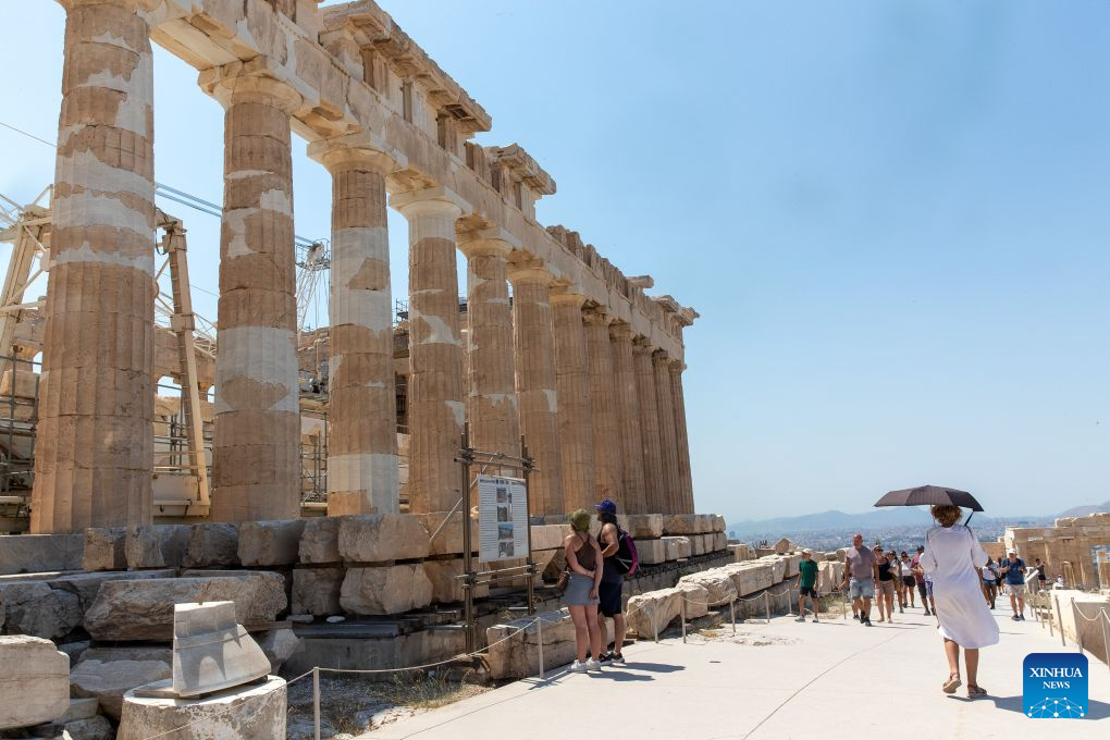 People visit the Acropolis during a heatwave in Athens, Greece, Aug. 25, 2026. (Xinhua/Marios Lolos)