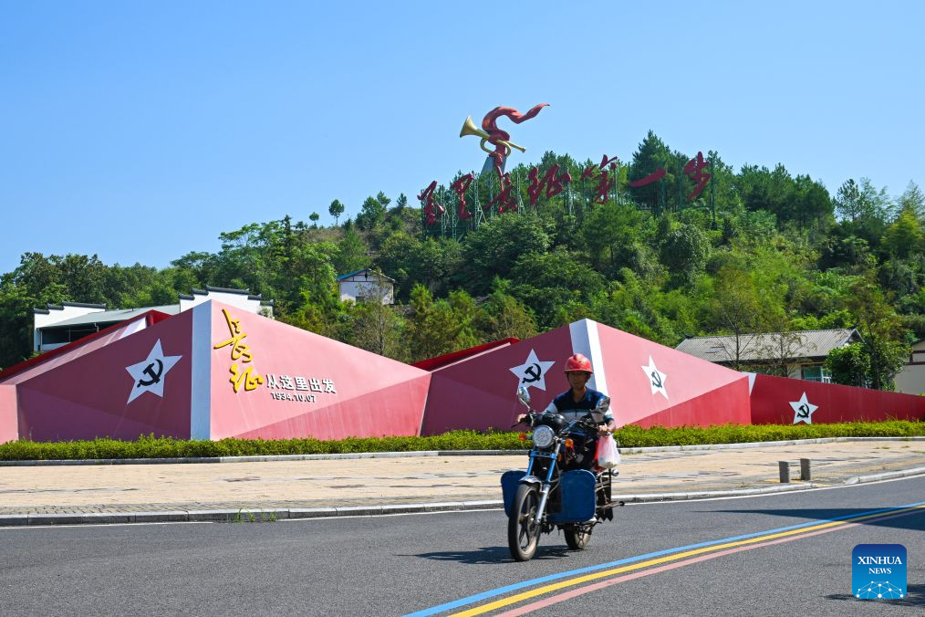 A man rides past a square in Huaitu Township in Ninghua County, southeast China's Fujian Province, Sept. 9, 2026. This year marks the 90th anniversary of the victory of the Long March by the Red Army under the leadership of the Communist Party of China (CPC). Ninghua is one of the starting points of the Long March by the Central Red Army. Huaitu in Ninghua has promoted the development of local tourism relying on its abundant red-themed tourism resources. (Xinhua/Zheng Huansong)