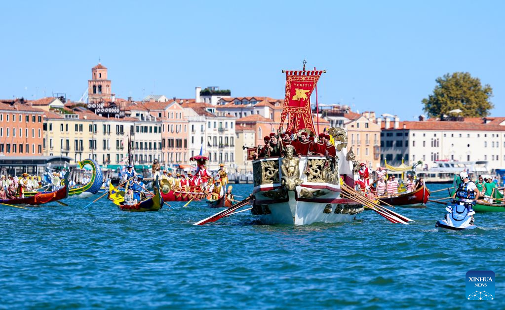 People take part in the Regata Storica boat race in Venice, Italy, Sept. 6, 2026. The Regata Storica is a historic annual boat parade and rowing race on the Grand Canal in Venice. (Xinhua/Wang Kaiyan)