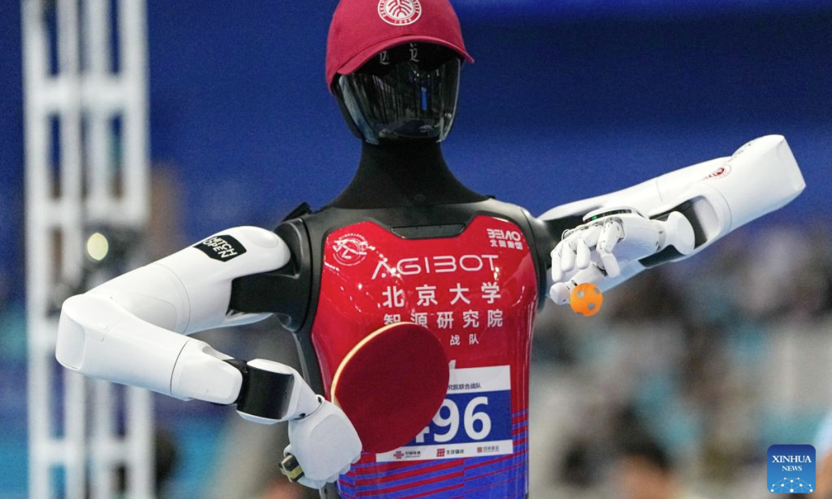 The robot of PKU-BAAI Team competes during the table tennis of the 2nd World Humanoid Robot Games in Beijing, capital of China, Aug. 25, 2026. (Xinhua/Ju Huanzong)