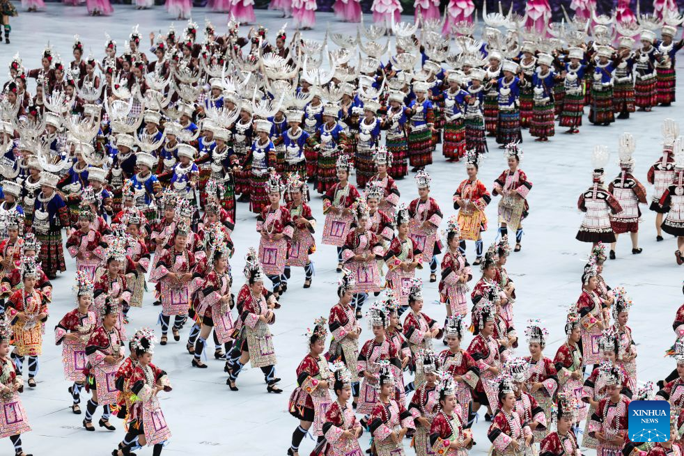 People from ethnic minority groups perform during a ceremony marking the 70th anniversary of the founding of Qiandongnan Miao and Dong Autonomous Prefecture in Kaili, Qiandongnan Miao and Dong Autonomous Prefecture, southwest China's Guizhou Province, July 23, 2026. Qiandongnan Miao and Dong Autonomous Prefecture, established on July 23, 1956, is home to 4.9 million people of the Miao, Dong, Han and other ethnic groups. (Xinhua/Yang Wenbin)