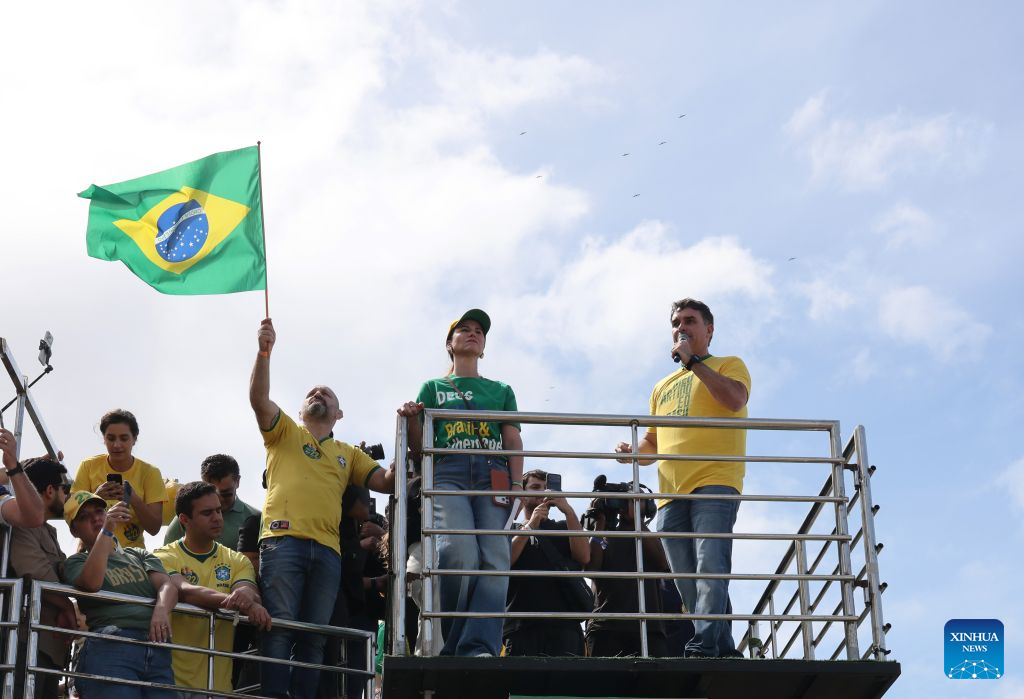 Brazilian Senator Flavio Bolsonaro (front R), presidential candidate of Brazil's Liberal Party, attends his first presidential campaign rally in Rio de Janeiro, Brazil, Aug. 16, 2026. (Xinhua/Jin Haoyuan)