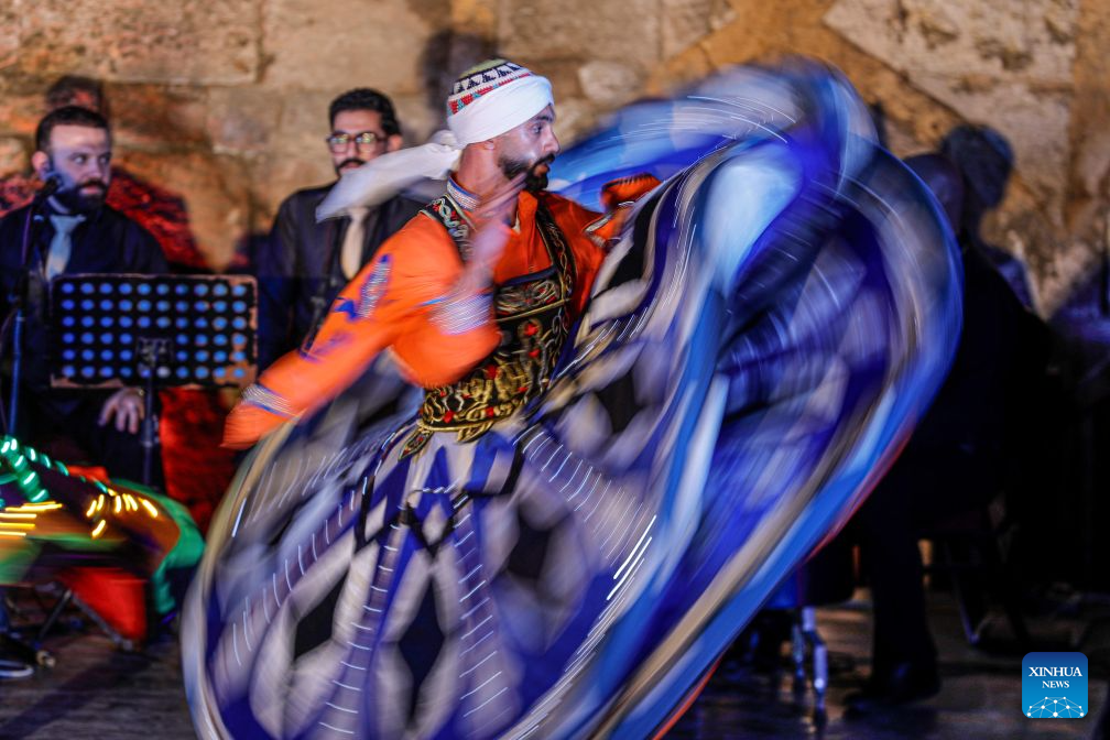 A dancer performs Tanoura, a traditional Egyptian folk dance, during the second edition of Heritage Revival Week in Cairo, Egypt, Aug. 25, 2026. (Xinhua/Ahmed Gomaa)