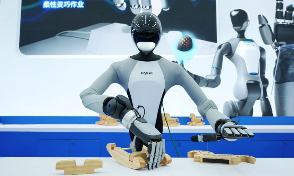 A robot exhibit from PaXini AI conducts a toy assembling challenge at the 2026 World Robot Conference in Beijing, capital of China, Aug. 19, 2026. (Xinhua)