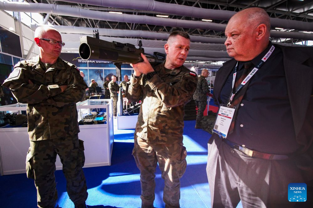 A visitor learn about a piece of equipment during the 34th International Defence Industry Exhibition in Kielce, Poland, Sept. 8, 2026. The event runs from Sept. 8 to 11, showcasing the latest defence equipment and technologies as well as solutions for communications, security, logistics and rescue. (Photo by Jaap Arriens/Xinhua)
