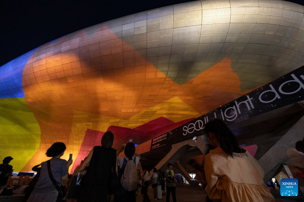People watch a media art show during Seoul Light DDP 2026 Fall at Dongdaemun Design Plaza (DDP) in Seoul, South Korea, Sept. 8, 2026. The event runs from Sept. 3 to 13 under the theme K-Original Light. (Photo by Jun Hyosang/Xinhua)
