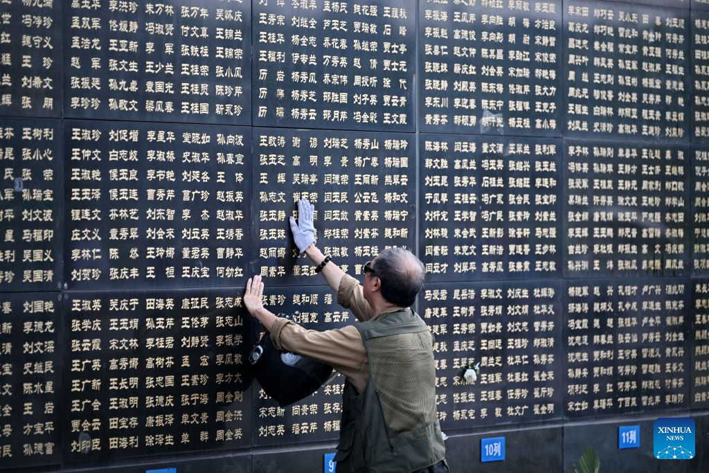 A citizen wipes the name of his relative on a memorial wall inscribed with names of the victims at the Tangshan Earthquake Memorial Park in Tangshan, north China's Hebei Province, July 28, 2026. This year marks the 50th anniversary of the Tangshan Earthquake, a magnitude-7.8 quake that struck the city on July 28, 1976, taking the lives of more than 240,000 people and destroying virtually all buildings in the city.

Crowds of people visited the Tangshan Earthquake Memorial Park on Tuesday to mourn and remember the victims in the devastating disaster. (Xinhua/Mu Yu)