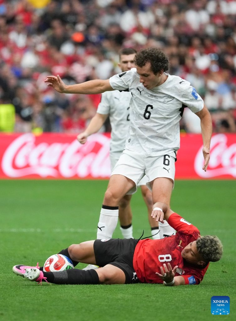 Emam Ashour (bottom) of Egypt vies with Joe Bell of New Zealand during a group G match between New Zealand and Egypt at the 2026 FIFA World Cup at BC Place Vancouver in Vancouver, Canada, June 21, 2026. (Xinhua/Meng Yongmin)