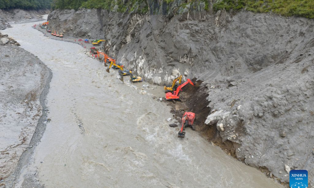 This aerial drone photo shows excavators repairing a section of national highway G216 in Gyirong County, southwest China's Xizang Autonomous Region, on Aug. 31, 2026.

Rescuers with China Anneng are carrying out clearing and restoration operations on the damaged road sections, striving to restore the vital access route to Gyirong Port. (Xinhua/Jiang Fan)