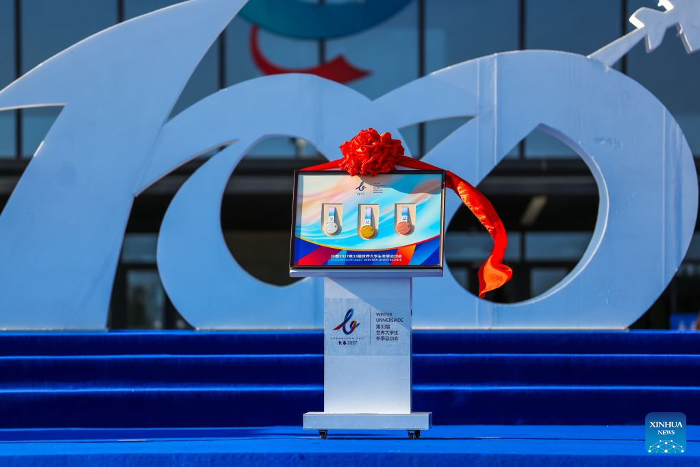 The medals are unveiled at the 100-day countdown event for the Changchun 2027 Winter Universiade in Changchun, northeast China's Jilin Province, Oct. 7, 2026. The medals, torch, uniforms and equipment for the Changchun 2027 Winter Universiade were unveiled on Wednesday at a 100-day countdown event held at the Changchun International Aviation Expo City. (Xinhua/Xu Chang)