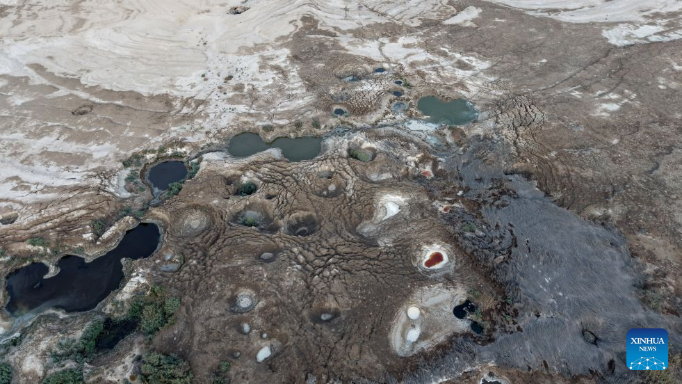 An aerial drone photo taken on Aug. 24, 2026 shows a view of sinkholes on the shore of the Dead Sea, near Ein Gedi beach of Israel. (Photo by Gil Cohen Magen/Xinhua)