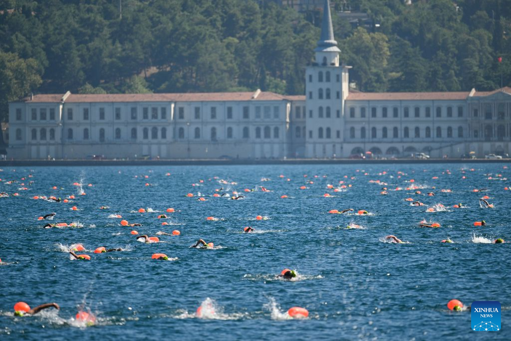 Swimmers compete during the 38th Bosphorus Cross-Continental Swimming Race in Istanbul, Türkiye, Aug. 23, 2026. (Xinhua/Liu Lei)