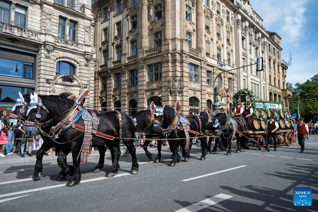 People participate in the Oktoberfest parade in Munich, Germany, Sept. 20, 2026. The 191st Oktoberfest, one of the largest folk festivals in Germany, opened on Saturday in Munich, and will last until Oct. 4. (Xinhua/Zhang Haofu)
