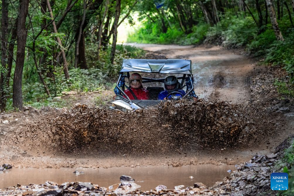 Tourists drive an off-road vehicle at the Lake Songhua Resort in Jilin City, northeast China's Jilin Province, Aug. 12, 2026. The Lake Songhua Resort, located in Jilin City, is a national-level ski tourism resort. In recent years, relying on its mountain resources, the resort has extended operation in other seasons except for winter, attracting tourists with natural scenery and mountain sports.

Since April 25 this year, the resort has received a total of 200,000 visitors, a year-on-year growth of 20 percent. From popular destination in winter to year-round operation, the tourism potential of the resort is being fully tapped, promoting the high-quality development of the local cultural and tourism industry. (Xinhua/Zhang Nan)