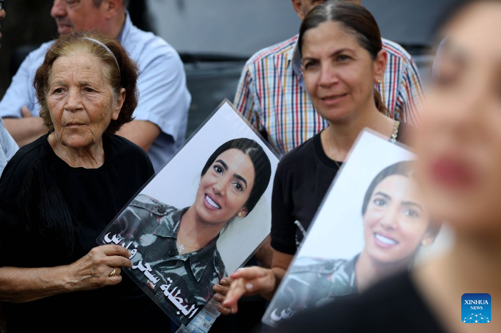 People hold portraits of the victims in commemoration of the sixth anniversary of the 2020 Beirut port blasts in Beirut, Lebanon, Aug. 4, 2026. (Xinhua/Bilal Jawich)