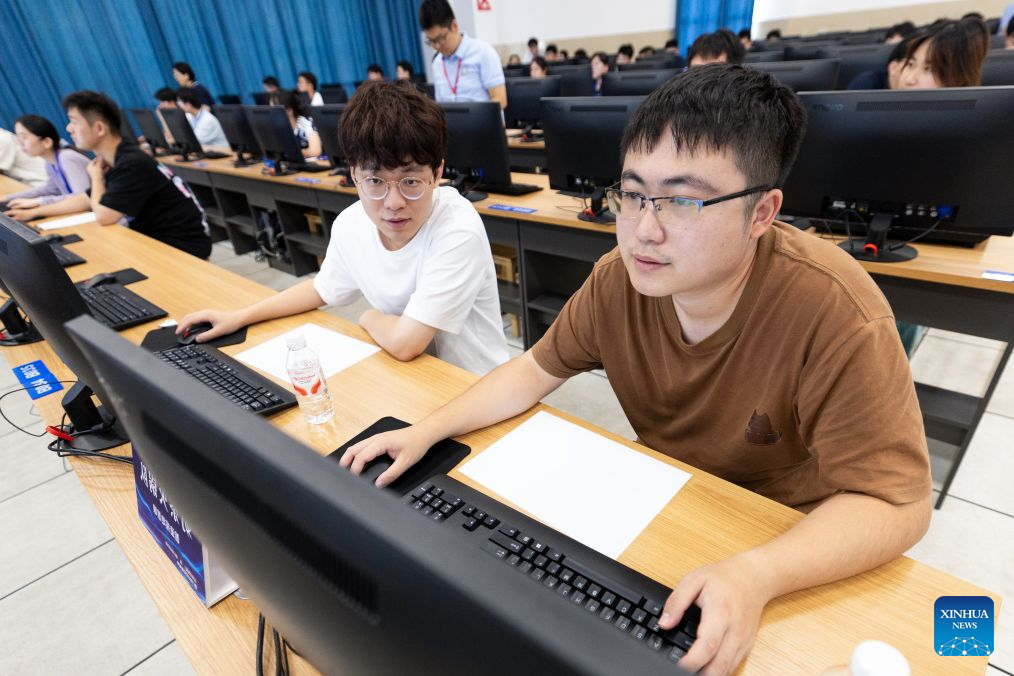 Contestants take part in the National Exploration Geophysics Competition for College Students at Yangtze University in Jingzhou City, central China's Hubei Province, Aug. 26, 2026. The competition kicked off here on Wednesday, with 148 teams from 32 colleges competing in software development and application. (Xinhua/Xiao Yijiu)