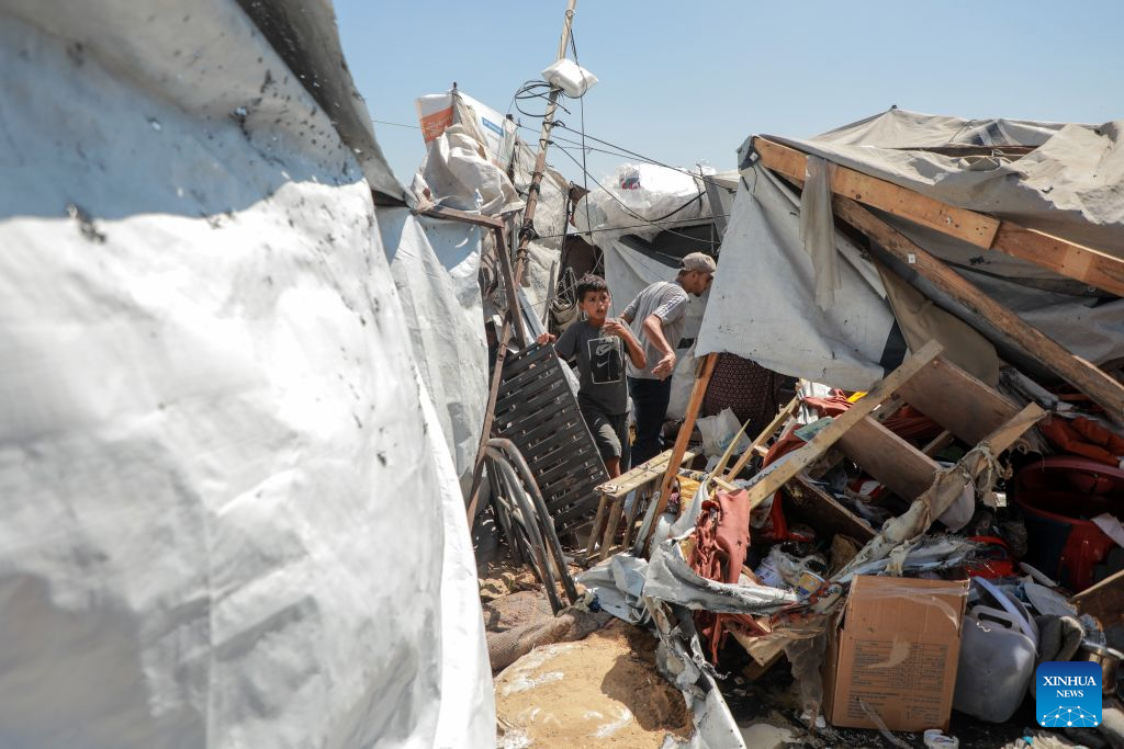 Palestinians inspect a damaged tent after it was targeted by a missile fired from an Israeli drone in the al-Rimal neighborhood in central Gaza, on Sept. 14, 2026. (Photo by Rizek Abdeljawad/Xinhua)