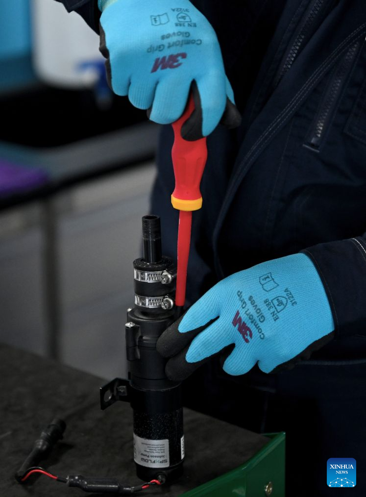 Lu Yi maintains a water pump during a simulated competition training at a training base of Henan Chemical Technician College in Kaifeng City, central China's Henan Province, Sept. 1, 2026. (Xinhua/Hao Yuan)