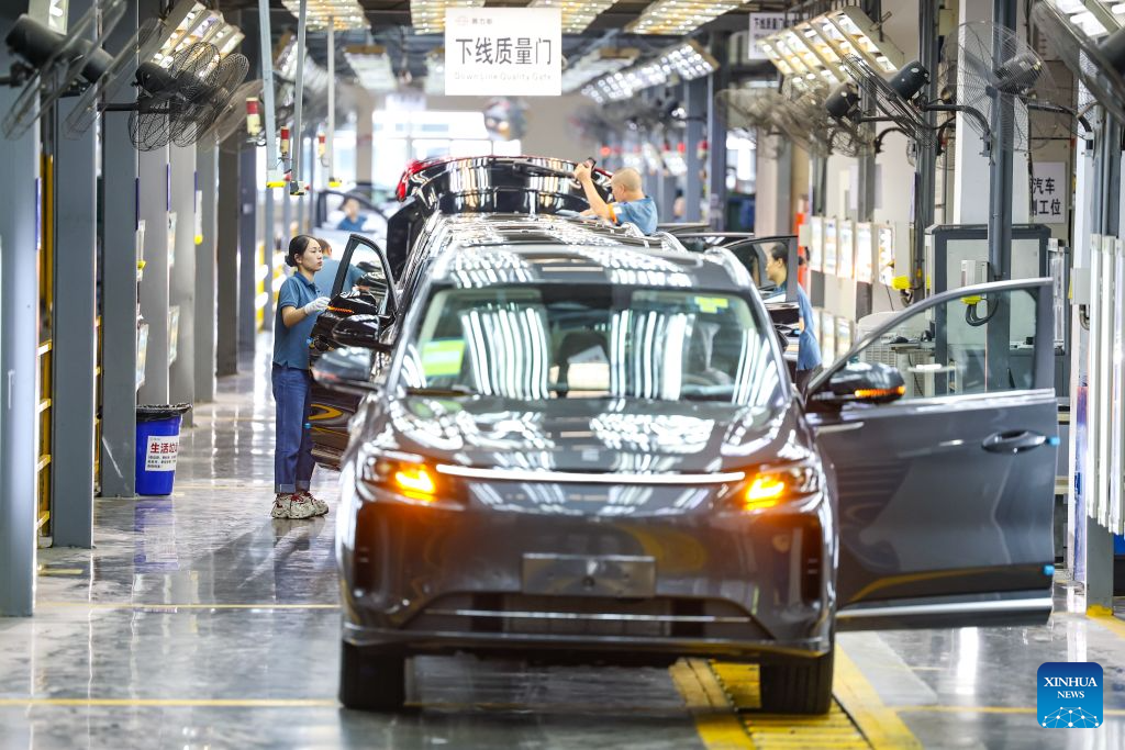 Workers inspect vehicles at a factory of carmaker Seres in southwest China's Chongqing Municipality, July 29, 2026.
Located at the intersection of the Belt and Road Initiative and the Yangtze River Economic Belt, Chongqing has leveraged its strategic location to develop an integrated logistics network connecting the New International Land-Sea Trade Corridor, China-Europe Railway Express and the Yangtze River.
Building on its role as a major transport hub, Chongqing has improved multimodal transportation systems and trade and investment services.
The city's logistics advantages have helped Chongqing-made products, including automobiles, electronic information products and manufacturing equipment, reach global markets, while facilitating imports of more high-quality products from overseas.
In 2025, Chongqing's national logistics hubs handled 120 million tonnes of cargo, with logistics-related business revenue exceeding 40 billion yuan (about 5.9 billion U.S. dollars). (Xinhua/Huang Wei)