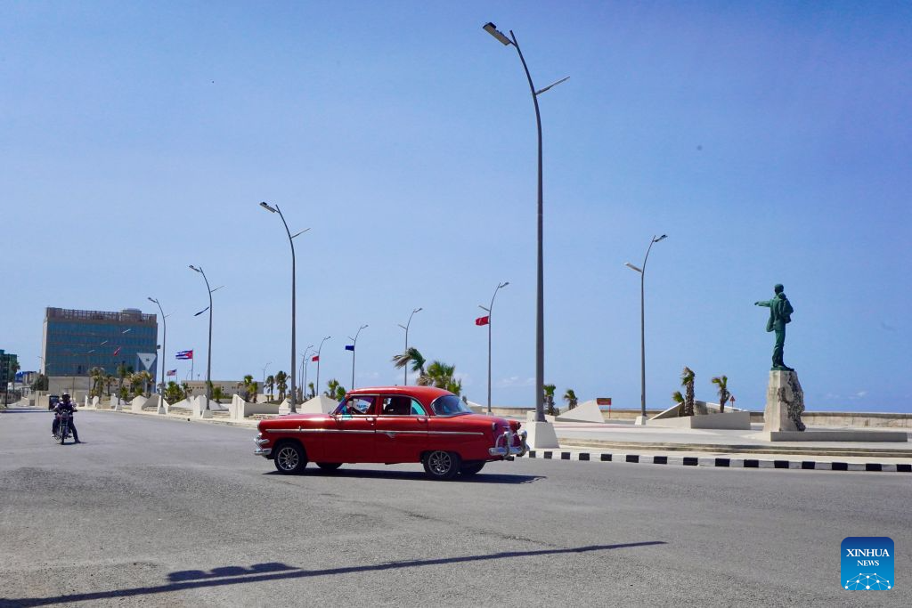 A vintage car drives past the Anti-Imperialist Platform in front of the U.S. Embassy in Cuba in Havana, capital of Cuba, on Aug. 25, 2026. The Cuban government on Tuesday condemned the United States' decision to extend for another year economic, commercial and financial blockade against Cuba until September 2027. (Xinhua/Jiang Biao)