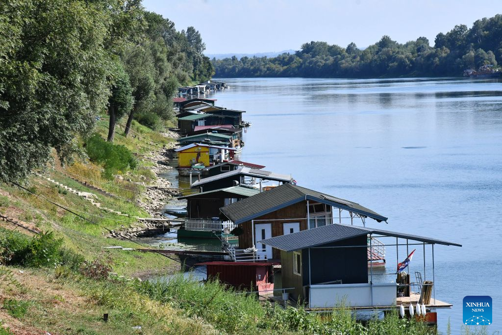 This photo taken on Aug. 4, 2026 shows Splavarska Street in Slavonski Brod, Croatia. Splavarska Street is unique in the country as its residents live on the water of Sava River, in houseboats with their own official addresses and house numbers. (Ivica Galovic/PIXSELL via Xinhua)