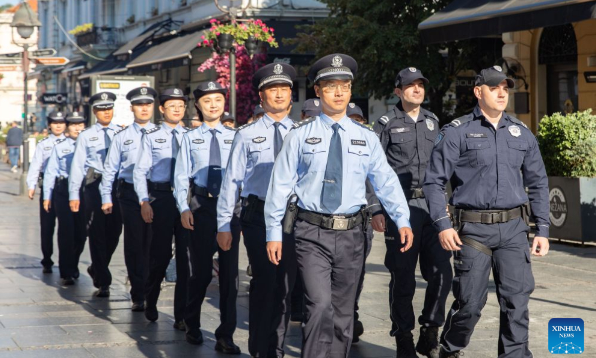 Chinese and Serbian police officers conduct a joint patrol on a street in Belgrade, Serbia, Sept. 23, 2026. Chinese and Serbian police officers launched a three-week joint patrol program in downtown Belgrade on Wednesday, aiming at assisting Chinese tourists and residents and strengthening bilateral law enforcement cooperation. (Photo by Wang Wei/Xinhua)