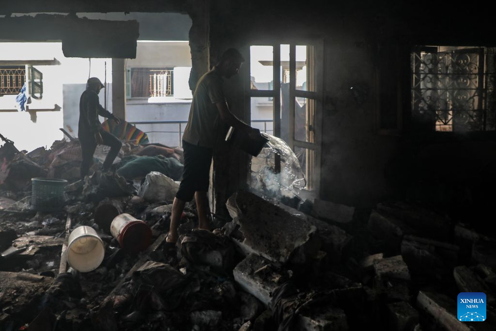 A Palestinian extinguishes fire in a destroyed residential apartment following an Israeli airstrike in Gaza City, Sept. 8, 2026. (Photo by Rizek Abdeljawad/Xinhua)