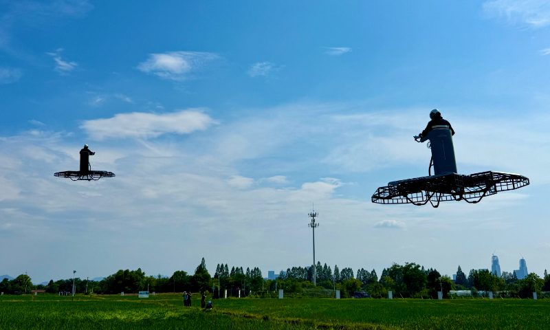 Passengers drive standing-posture manned flying vehicles in Hangzhou, East China's Zhejiang Province, on August 10, 2026. The vehicles were developed by Hangzhou-headquartered Chinese startup CoolFly. Photo: Courtesy of CoolFly 