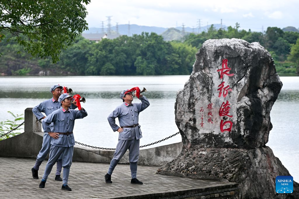 Performers stage a short outdoor performance, titled Farewell, in Yudu County of Ganzhou City, east China's Jiangxi Province, July 28, 2026. At a ferry in Yudu County, a short outdoor performance is staged every few days. The performance, titled Farewell, recreates the autumn of 1934, when local residents in Yudu County saw off troops led by the Communist Party of China as they set out on the Long March.
Nearly 300 volunteers from all walks of life team up with over 20 professional actors to bring the production to life. Since its public debut in 2021, Farewell has been staged more than 800 times. (Xinhua/Liu Jinhai)