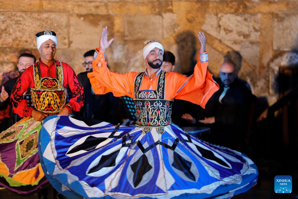 A dancer performs Tanoura, a traditional Egyptian folk dance, during the second edition of Heritage Revival Week in Cairo, Egypt, Aug. 25, 2026. (Xinhua/Ahmed Gomaa)
