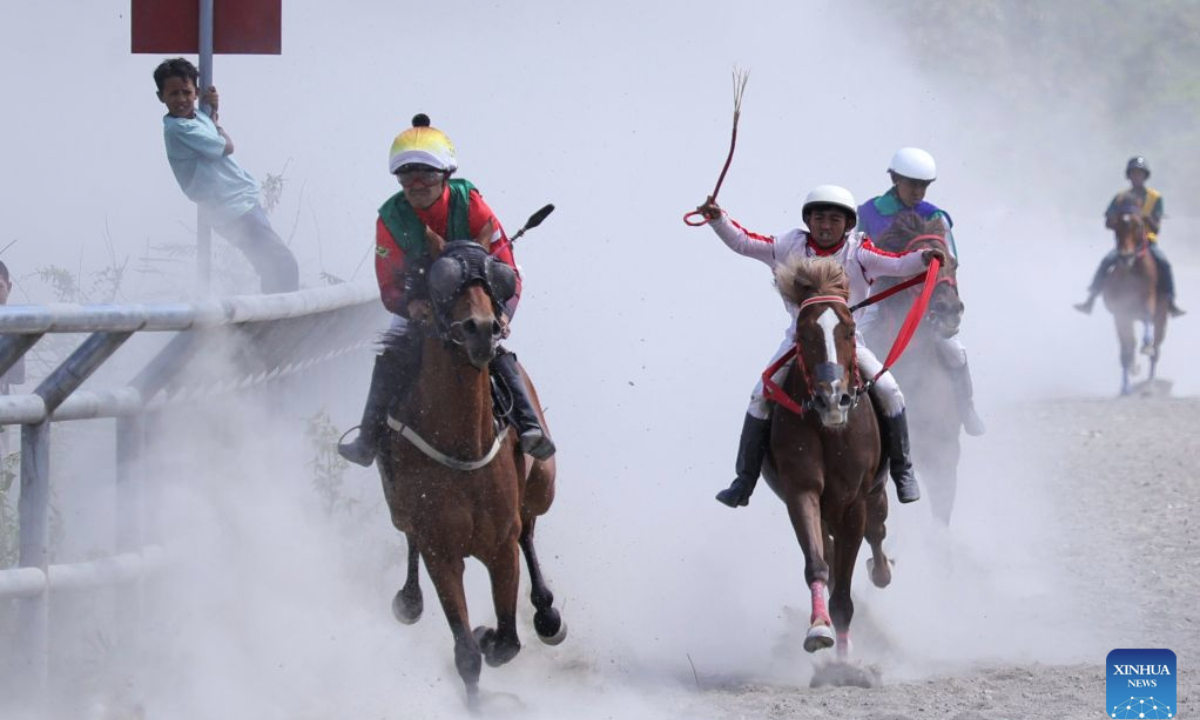 Young jockeys compete in a traditional horse race in Central Aceh Regency, Aceh Province, Indonesia, Aug. 30, 2026. (Photo by Fachrul Reza/Xinhua)