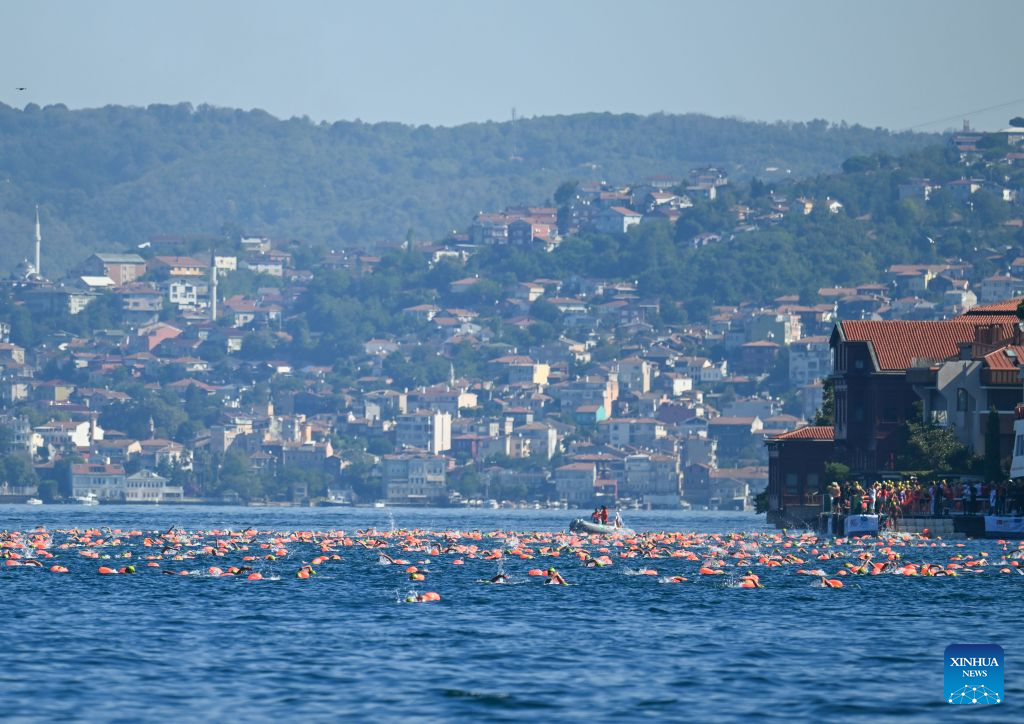 Swimmers compete during the 38th Bosphorus Cross-Continental Swimming Race in Istanbul, Türkiye, Aug. 23, 2026. (Xinhua/Liu Lei)