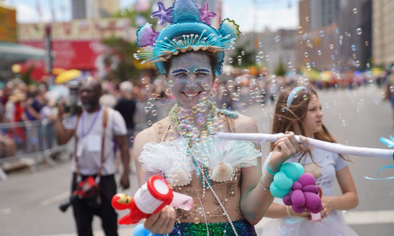 People participate in the 2026 Mermaid Parade on the Coney Island in New York, the United States, June 20, 2026. (Xinhua/Zhang Fengguo)