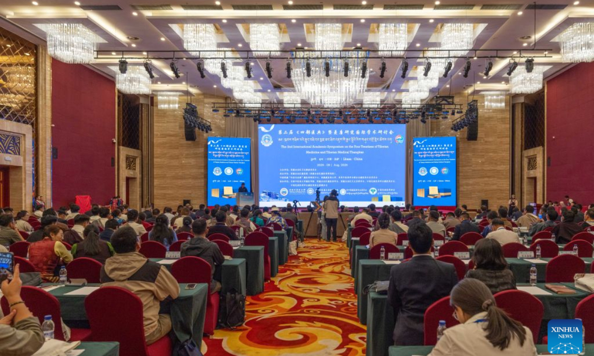 The second international academic symposium on The Four Treatises of Tibetan Medicine and Tibetan medical thangkas is held in Lhasa, southwest China's Xizang Autonomous Region, Aug. 20, 2026. An international symposium opened in southwest China's Xizang Autonomous Region on Thursday to shed light on the growing global interest in traditional Tibetan medicine and its visual illustrations drawn on thangkas. Held in the regional capital Lhasa, the second international academic symposium on The Four Treatises of Tibetan Medicine and Tibetan medical thangkas brought together more than 200 experts from China, Britain, Germany, Austria, Mongolia and Nepal. Discussions centered on the historical evolution of the classic treatises, the iconographic interpretation of Tibetan medical thangkas, and pathways for modern clinical application and international cooperation. Written between the 8th and 12th centuries, The Four Treatises of Tibetan Medicine is the most influential foundational work on traditional Tibetan medicine. It was inscribed on the UNESCO Memory of the World Register in 2023. Based on the work, the 80-scroll Tibetan medical thangkas serve as a visual teaching complement, covering diagnostics, pharmacology, preventive care and medical ethics. The medical thangkas were added to China's national documentary heritage list also in 2023. (Xinhua/Tenzing Nima Qadhup)