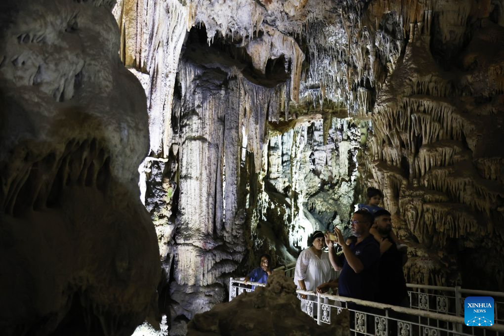 People visit the Beni Add caves in Tlemcen, Algeria, Aug. 17, 2026. The main gallery of Beni Add caves extend over 700 meters, with a depth reaching 57 meters, and are home to stalactites and stalagmites of varied shape. (Photo by Billel Bensalem/Xinhua)