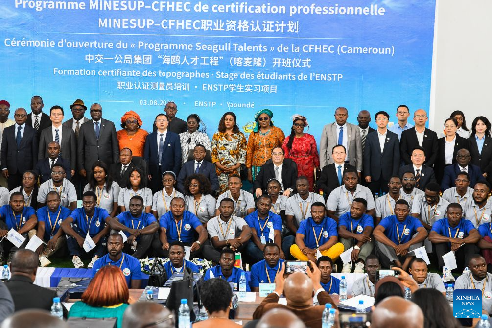 Guests take a group photo with program student trainees after the launching ceremony in Yaounde, Cameroon, Aug. 3, 2026. China First Highway Engineering Co., Ltd. (CFHEC) launched a training initiative Monday to build local expertise in Cameroon. The Seagull Talent Program was launched in the capital, Yaounde, with senior Cameroonian government officials, Chinese diplomats, faculty from the National Advanced School of Public Works (ENSTP), and the trainees in attendance. The 10-day course brings together 54 participants, including 24 local project staff and 30 ENSTP students. (Xinhua/Kepseu)