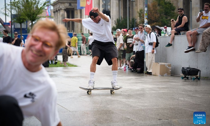 A man rides a skateboard to celebrate the annual Go Skateboarding Day in Warsaw, Poland, June 21, 2026. (Photo by Jaap Arriens/Xinhua)