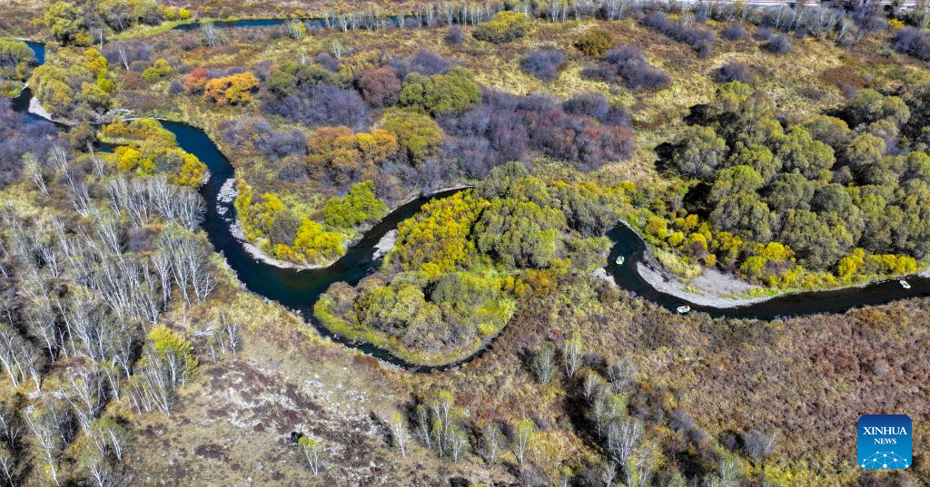 An aerial drone photo taken on Sept. 17, 2026 shows tourists enjoying drifting at a scenic area in Arxan of Hinggan League, north China's Inner Mongolia Autonomous Region. (Xinhua/Bei He)