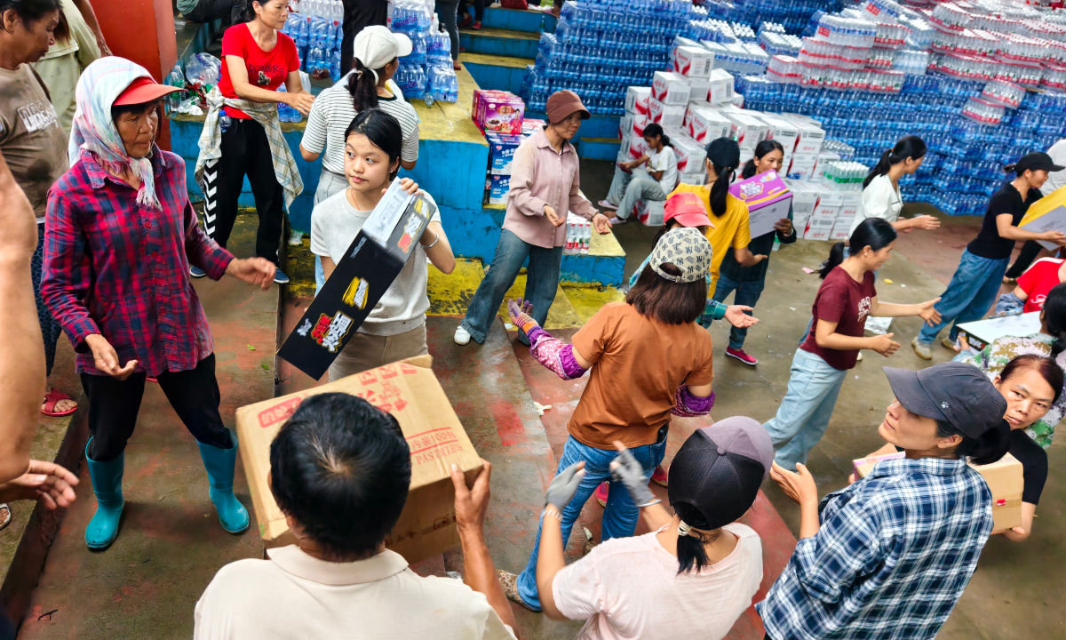 Local residents receive disaster relief supplies at a disaster resettlement site in Yunbiao township in Hengzhou city, South China’s Guangxi Zhuang Autonomous Region on July 8, 2026. Photo: VCG 