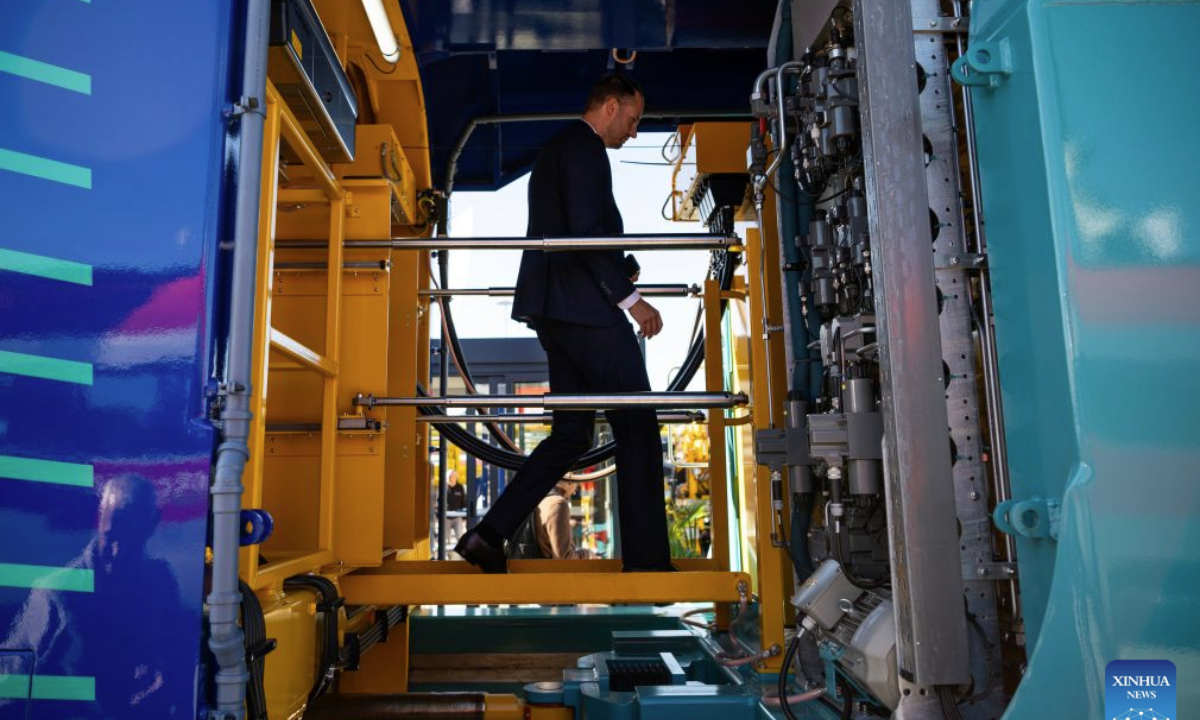 A man tours a train during the 2026 International Trade Fair for Transport Technology (InnoTrans 2026) in Berlin, Germany, Sept. 22, 2026. The fair kicked off here on Tuesday and will last until Sept. 25. (Xinhua/Zhang Haofu)