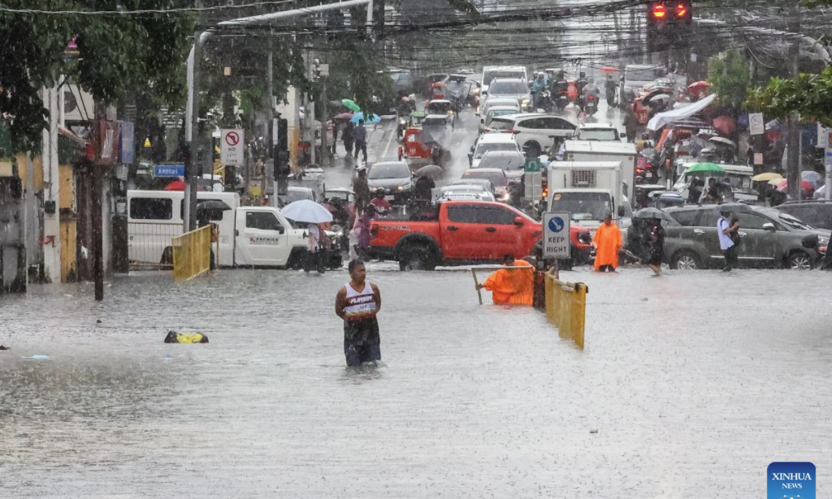 A man wades through floodwater in Quezon City, the Philippines, on Aug. 17, 2026. The Philippine government has suspended in-person classes in Metro Manila and 12 other provinces as heavy rains from tropical cyclones and the southwest monsoon continue to batter the country, local media reported on Monday.
The extreme rainfall has triggered severe flooding and landslides across the nation. The well-known flood-control corruption scandal has left key infrastructure unfinished or poorly maintained, further straining the country's disaster response, local media reported. (Xinhua/Rouelle Umali)