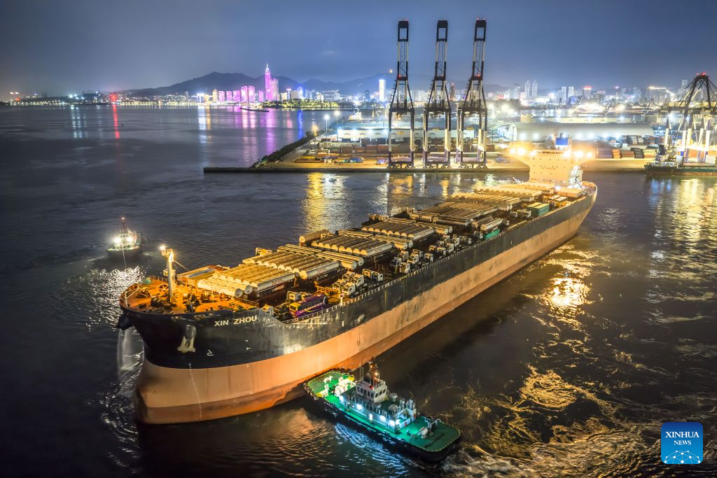 A drone photo taken on Aug. 16, 2026 shows a vessel carrying China-produced vehicles bound for Ghana departing from Yantai Port in east China's Shandong Province. Yantai Port's general cargo shipment volume to Africa has exceeded 6 million tonnes since the beginning of this year, a year-on-year increase of 66.1 percent. (Photo by Zhang Chao/Xinhua)