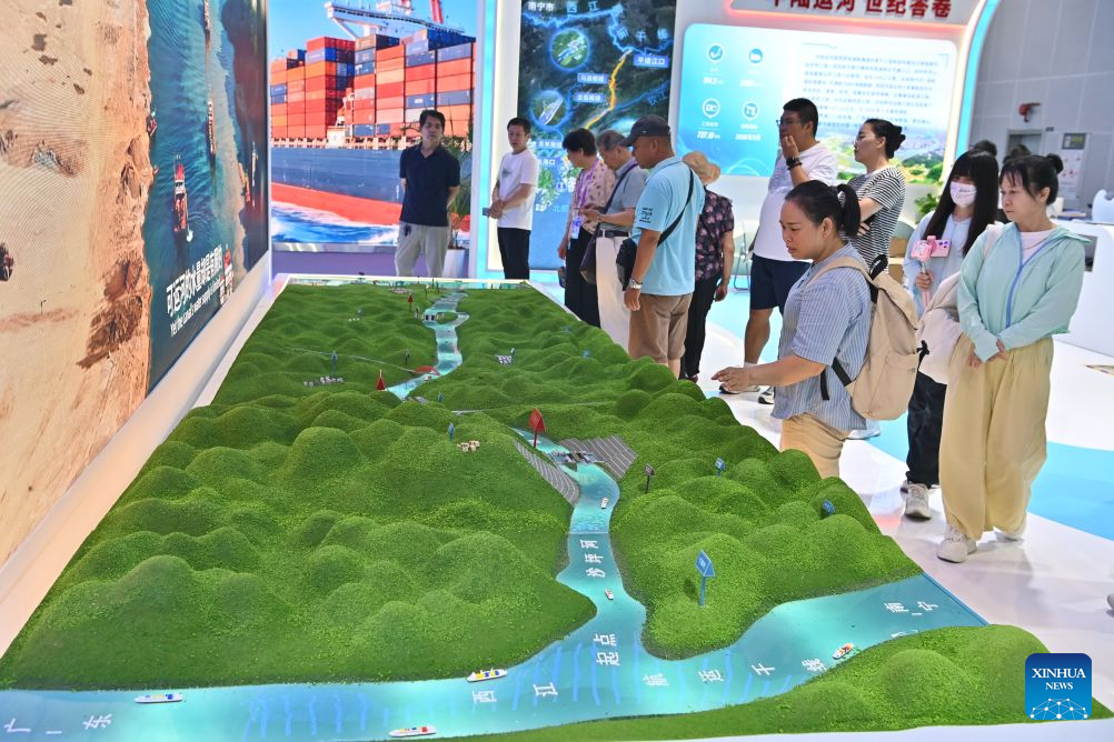 Visitors view displays related to the Pinglu Canal at the 23rd China-ASEAN Expo in Nanning, south China's Guangxi Zhuang Autonomous Region, Sept. 21, 2026. The 23rd China-ASEAN Expo concluded in Nanning on Monday. (Xinhua/Zhou Hua)