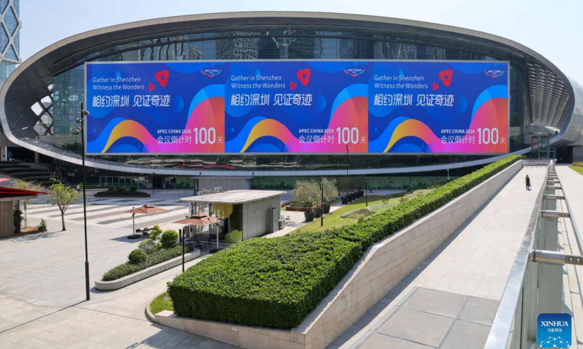 This photo taken on Aug. 10, 2026 shows a view of the Shenzhen Bay Sports Center, with a bulletin board indicating the 100-day countdown to the 33rd Asia-Pacific Economic Cooperation (APEC) Economic Leaders' Meeting, in Shenzhen, south China's Guangdong Province. With themed bulletin boards, outdoor posts, decorations and installations, Shenzhen marked on Monday the 100-day countdown to the 33rd Asia-Pacific Economic Cooperation (APEC) Economic Leaders' Meeting. (Xinhua/Liang Xu)