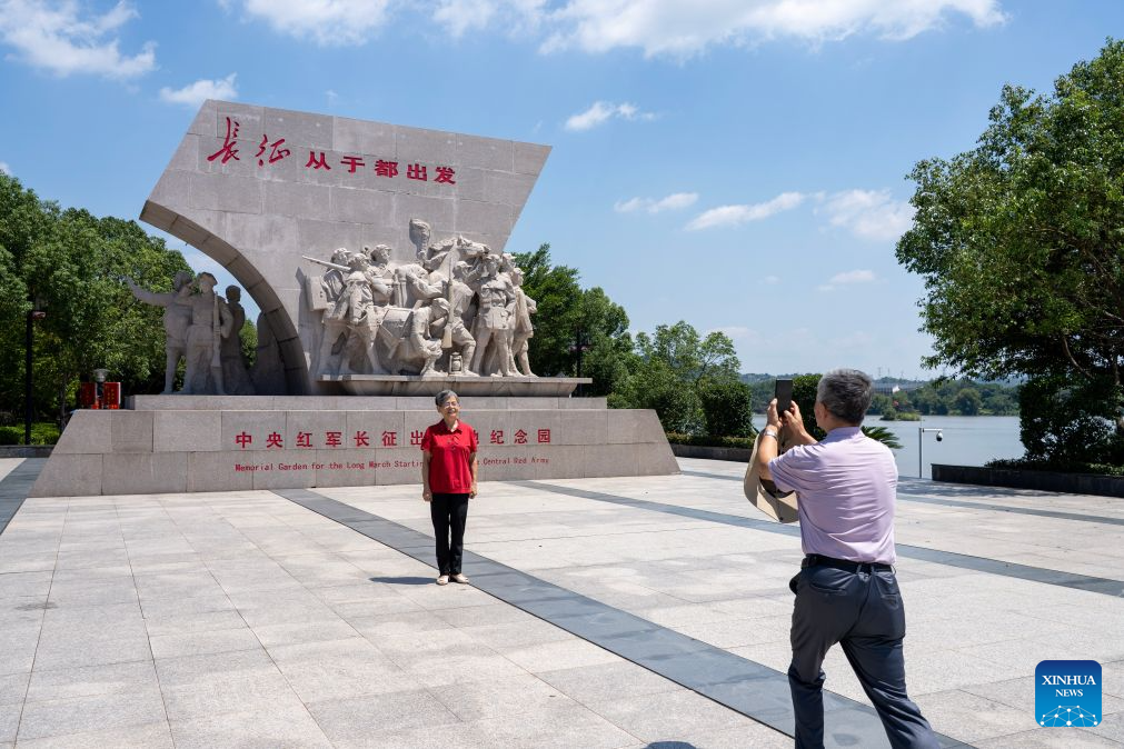 A tourist poses for a photo at the Memorial Garden for the Long March Starting Point of the Central Red Army in Yudu County, east China's Jiangxi Province, Sept. 8, 2026. This year marks the 90th anniversary of the victory of the Long March by the Red Army under the leadership of the Communist Party of China (CPC). As the starting point of the Long March by the Central Red Army, Yudu County has leveraged its abundant red-themed tourism resources to diversify tourism experiences, promoting both the inheritance of the Long March spirit and the development of local tourism. (Xinhua/Cao Mengyao)