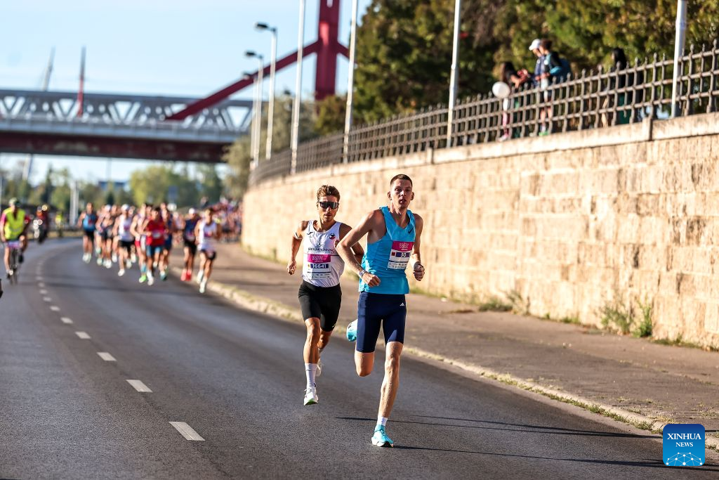 Gabor Karsai (R) of Hungary and Riccardo Mugnosso of Italy compete in the 41st Wizz Air Budapest Half Marathon in Budapest, Hungary, Sept. 6, 2026. (Photo by David Balogh/Xinhua)