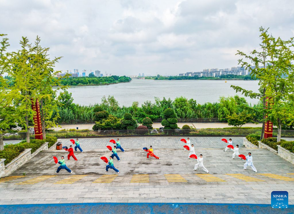 An aerial drone photo taken on Aug. 5, 2026 shows citizens doing exercise at a park in Yangzhou, east China's Jiangsu Province. On the occasion of National Fitness Day, a legacy of the 2008 Beijing Olympics, more people are embracing active lifestyles. (Photo by Ren Fei/Xinhua)