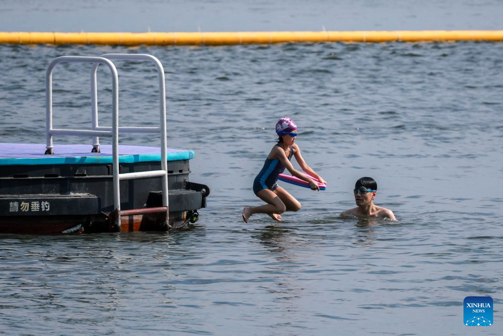 People swim in the sea in Hong Kong, south China, Aug. 9, 2026.
Hong Kong's temperature had reached 36.9 degrees Celsius by 3:30 p.m. on Sunday, the highest since the city started keeping meteorological records in 1884, according to the Hong Kong Observatory. (Xinhua/Lui Sui Wai)